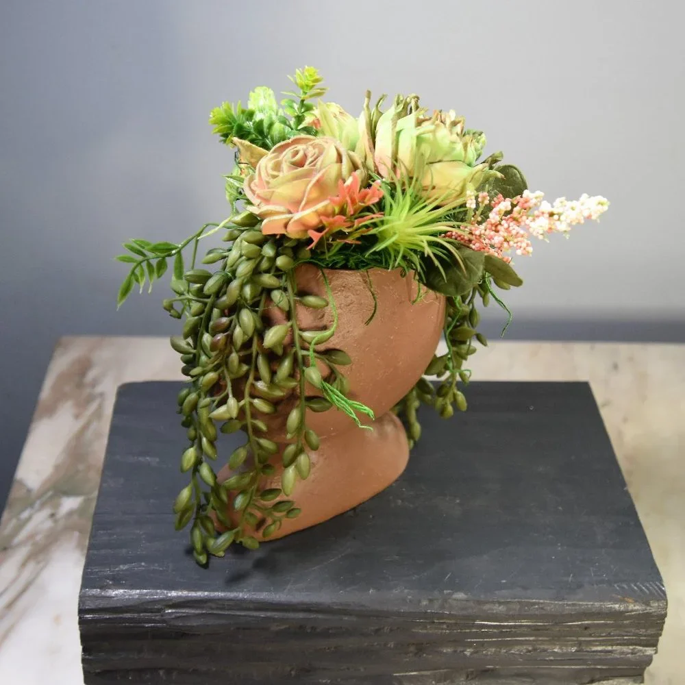 Serene, peaceful airbrushed Sola wood succulents in a fun fabulous face planter